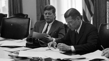 President Kennedy and Defense Secretary Robert McNamara confer on the crisis in October 1962.   