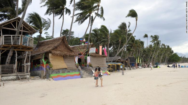 Tourists walk along the famed Boracay island beach in this shot from 2008.