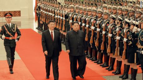 Chinese President Xi Jinping (left) and North Korean leader Kim Jong Un (right) are seen together in Beijing in a photograph released by North Korea&#39;s state-run Korean Central News Agency.