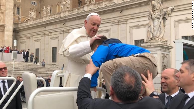 180328184330-pope-francis-kisses-child-c