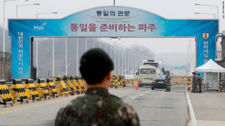 South Korean soldiers stand as vehicles carrying a South Korean delegation pass the Unification Bridge, which leads to Panmunjom in the Demilitarized Zone, South Korea, Thursday, March 29.