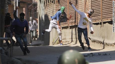 Protesters clash with Indian policemen in Kashmir on April 1, 2018.