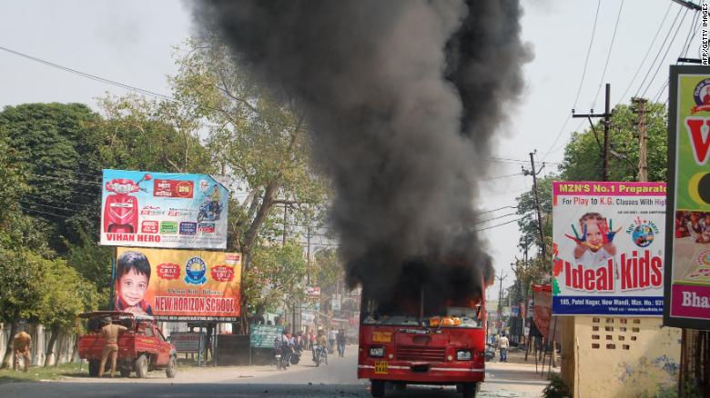 An Indian public bus burns during countrywide protests against a Supreme Court order seen as diluting protections afforded to lower castes.