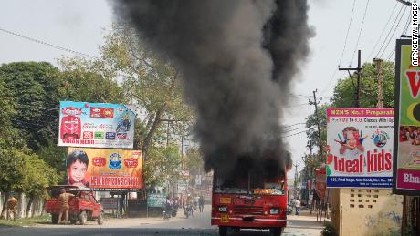 An Indian public bus burns during countrywide protests against a Supreme Court order seen as diluting protections afforded to lower castes.