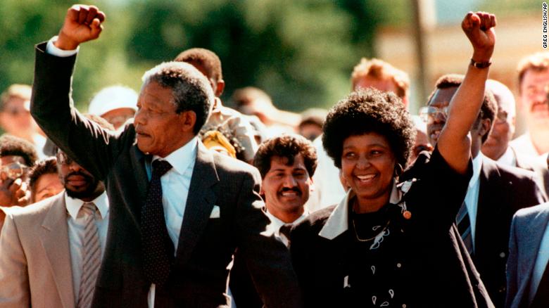 Nelson and Winnie Mandela raise clenched fists to supporters upon Nelson&#39;s release from jail in February 1990. 