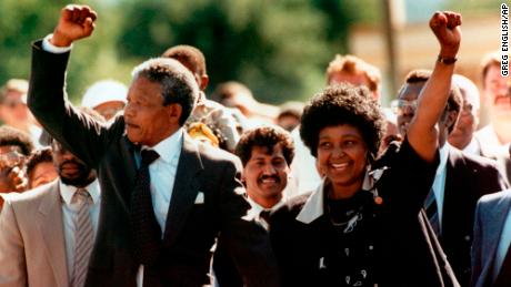 Nelson and Winnie Mandela raise fists to supporters after his release from jail in February 1990.