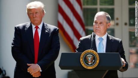 President Donald Trump listens as EPA Administrator Scott Pruitt speaks about the U.S. role in the Paris climate change accord, Thursday, June 1, 2017, in the Rose Garden of the White House in Washington. (AP Photo/Pablo Martinez Monsivais)