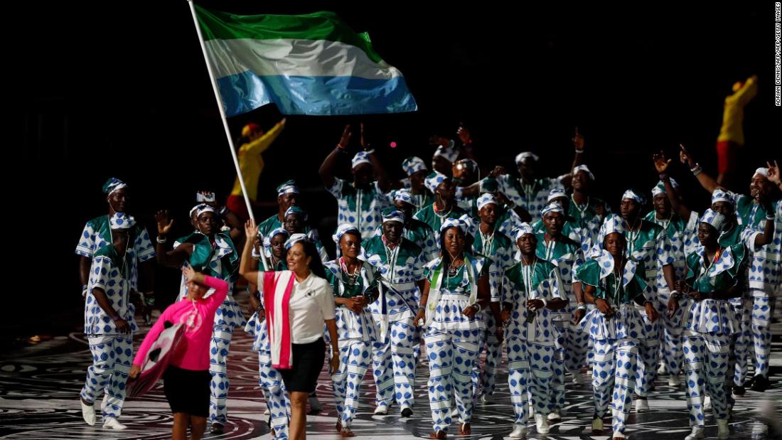 Sierra Leone&#39;s flagbearer Hafsatu Kamara leads the delegation during the opening ceremony.