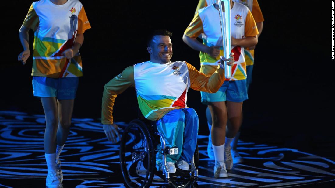 Kurt Fearnley showcases the Queen&#39;s Baton, which left Buckingham Palace in March 2017 and traveled for 388 days and 143 thousand miles through the entire Commonwealth. 