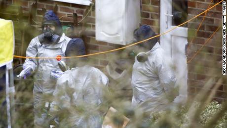 Investigators work in the garden of Sergei Skripal's house on March 22.