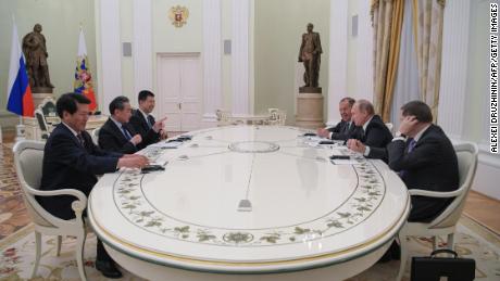 Russian President Vladimir Putin meets with Chinese Foreign Minister Wang Yi at the Kremlin in Moscow on April 5.