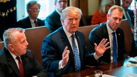 WASHINGTON, DC - APRIL 9: (AFP OUT) U.S. President Donald J. Trump (C) speaks with the media before a meeting with his cabinet in the Cabinet Room of the White House April 9, 2018 in Washington DC. Trump said he will decide in the next few days whether  the US will respond militarily for the reported chemical weapons attack in Syria. (Photo by Jim Lo Scalzo-Pool/Getty Images)