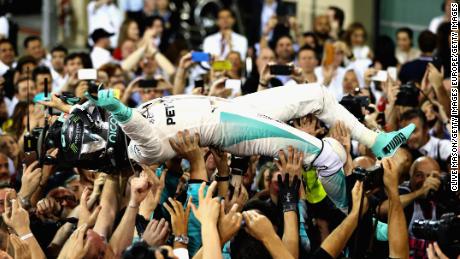 Nico Rosberg celebrates after finishing second and winning the World Drivers Championship during the Abu Dhabi Formula One Grand Prix at Yas Marina Circuit on November 27, 2016.