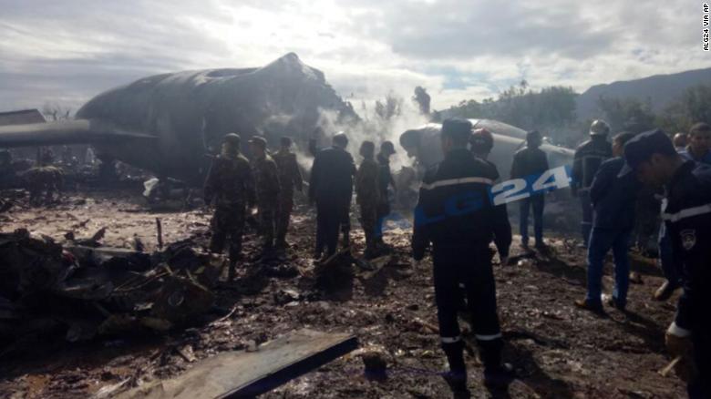 Firefighters and soldiers at the scene of the crash.