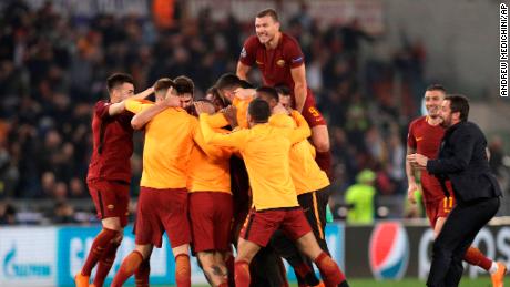 AS Roma players celebrate at the end of the Champions League quarterfinal second leg soccer match between Roma and FC Barcelona at Rome&#39;s Olympic Stadium on Tuesday.