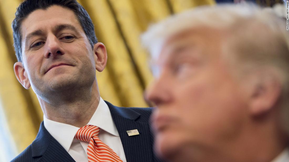 Trump speaks to Ryan after signing a bill in 2017 in the Oval Office.