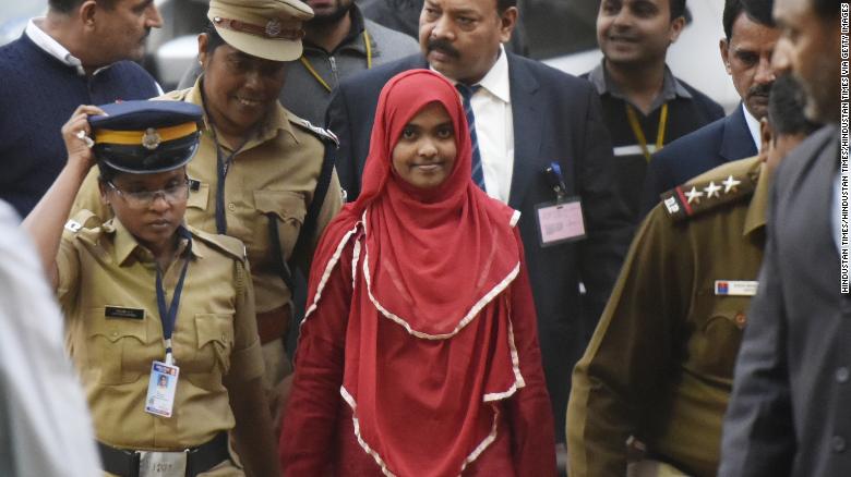 Hadiya [center) arrives at an earlier Supreme Court hearing on November 27, 2017, in New Delhi, India. 