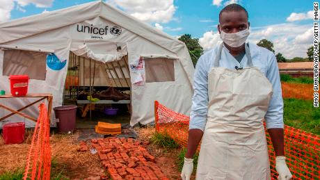 TOPSHOT - A medical personnel stands in front of a ward of a Cholera Treatment Centre, funded by the Unicef, Malawi Red Cross and UK Aid, at Bwaila Hospital in the capital Lilongwe, Malawi, January 25, 2018. 
Malawi has been facing a cholera outbreak since late 2017 and UNICEF Malawi is making efforts to contain the outbreak.  / AFP PHOTO / AMOS GUMULIRA        (Photo credit should read AMOS GUMULIRA/AFP/Getty Images)
