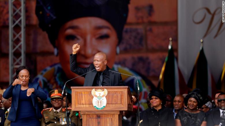 Winnie Madikizela-Mandela&#39;s image serves as a backdrop at her funeral Saturday at Orlando Stadium in Soweto, as Julius Malema, leader of the Economic Freedom Fighters populist opposition party, pays tribute to her. 