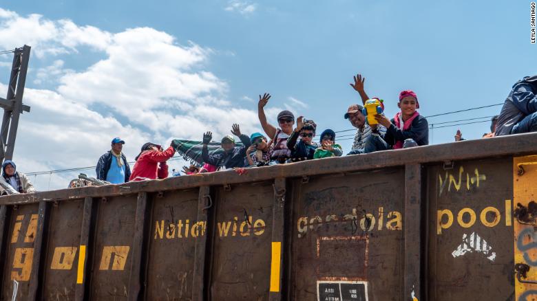 Migrants climbed onto the freight train Saturday in the city of Tultitlán, 1,500 miles south of the US-Mexico border. 