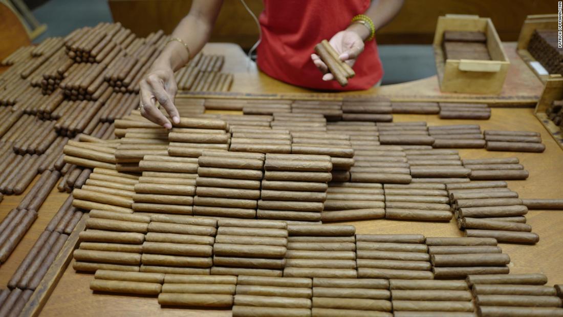 A worker at the Partagas factory in Havana sorts some of Cuba&#39;s famed cigars to ensure that each box contains tobacco of the same color. Cuban cigars are still rolled by hand as they have been for generations. For years, Cuban cigars were banned in the US, but as part of his shift in policy toward Cuba, President Obama changed the law to allow US citizens to bring habanos back from trips abroad. The US trade embargo still prohibits the sale of Cuban cigars in the US.