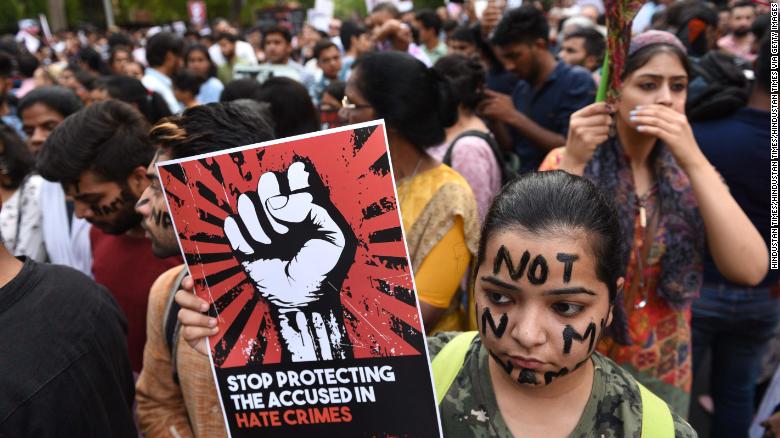 Protesters take part in the &#39;Not In My Name&#39; protest against the Kathua and Unnao rape cases, in New Dehli on April 15.