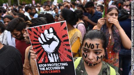 Protesters take part in the &#39;Not In My Name&#39; protest against the Kathua and Unnao rape cases, in New Dehli on April 15.