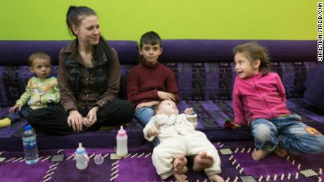 Samantha Sally speaks to CNN in northern Syria with her children. 