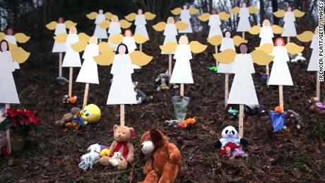 NEWTOWN, CT - DECEMBER 16:  Twenty seven wooden stand in a yard down the street from the Sandy Hook School December 16, 2012 in Newtown, Connecticut. Twenty-six people were shot dead, including twenty children, after a gunman identified as Adam Lanza opened fire at Sandy Hook Elementary School. Lanza also reportedly had committed suicide at the scene. A 28th person, believed to be Nancy Lanza, found dead in a house in town, was also believed to have been shot by Adam Lanza.  (Photo by Spencer Platt/Getty Images)