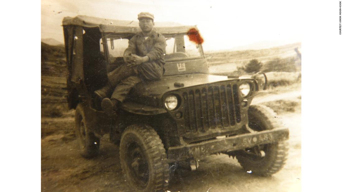 Kwon Moon-Kook is pictured sitting on a military vehicle around the time of the Korean War.