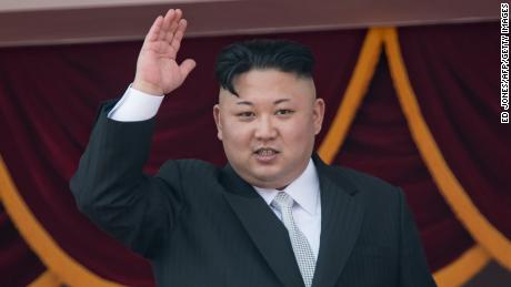 North Korean leader Kim Jong-Un waves from a balcony of the Grand People's Study house following a military parade marking the 105th anniversary of the birth of late North Korean leader Kim Il-Sung, in Pyongyang on April 15, 2017. 
Kim saluted as ranks of goose-stepping soldiers followed by tanks and other military hardware paraded in Pyongyang for a show of strength with tensions mounting over his nuclear ambitions. / AFP PHOTO / ED JONES        (Photo credit should read ED JONES/AFP/Getty Images)