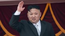 North Korean leader Kim Jong-Un waves from a balcony of the Grand People's Study house following a military parade marking the 105th anniversary of the birth of late North Korean leader Kim Il-Sung, in Pyongyang on April 15, 2017. 
Kim saluted as ranks of goose-stepping soldiers followed by tanks and other military hardware paraded in Pyongyang for a show of strength with tensions mounting over his nuclear ambitions. / AFP PHOTO / ED JONES        (Photo credit should read ED JONES/AFP/Getty Images)