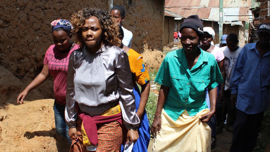 Phyllis Omido walks through the village of Owino Uhuru. She has been keeping a close eye on the lead exposure that has plagued this settlement since a nearby smelter began operations in 2007. 