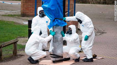  Army officers remove the bench where Sergei Skripal and his daughter were found last month.