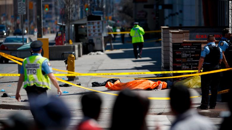 A body lies covered after the chaos near midtown Toronto.
