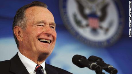 Former US president George H. W. Bush introduces his son US President George W. Bush (not pictured) during the dedication ceremony of the new US embassy on August 8, 2008 in Beijing. US President George W. Bush on August 8 made a new plea for freedom of expression in China as he prepared to attend the opening ceremony of the 2008 Beijing Olympic Games later in the day.   AFP PHOTO / Mandel NGAN (Photo credit should read MANDEL NGAN/AFP/Getty Images)