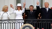 President Donald Trump, French President Emmanuel Macron, first lady Melania Trump and Brigitte Macron hold hands on the White House balcony during a State Arrival Ceremony at the White House in Washington, Tuesday, April 24, 2018. [AP Photo/Pablo Martinez Monsivais)