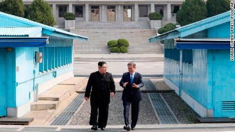 North Korean leader Kim Jong Un, left, listens to South Korean President Moon Jae-in while walking together at the Panmunjom in the Demilitarized Zone Friday, April 27, 2018. Kim made history Friday by crossing over the world&#39;s most heavily armed border to greet his rival, Moon, for talks on North Korea&#39;s nuclear weapons. (Korea Summit Press Pool via AP)