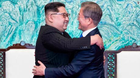 North Korean leader Kim Jong Un, left, and South Korean President Moon Jae-in embrace each other after signing on a joint statement at the border village of Panmunjom in the Demilitarized Zone, South Korea, Friday, April 27, 2018. (Korea Summit Press Pool via AP)