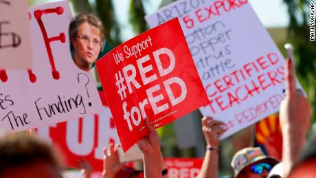 Teachers rally outside the Capitol in Phoenix on Friday during  their second day of walkouts. 