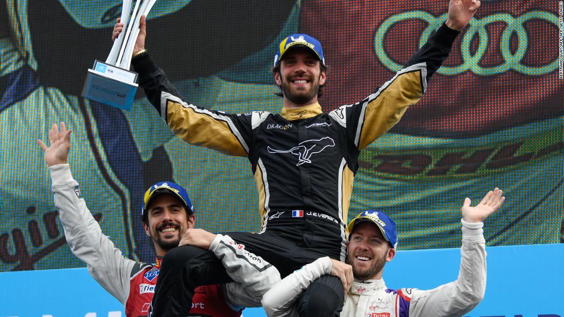 Vergne was hoisted by runner-up Lucas di Grassi (left) and Bird after winning the Paris ePrix.