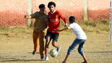 Egyptian boys play football at the Mohamed Salah Youth Center in the Egyptian village of Nagrig, about 120 kilometers northwest of Cairo.
