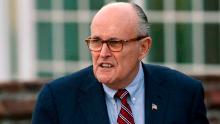 FILE - In this Nov. 20, 2016 file photo, former New York Mayor Rudy Giuliani arrives at the Trump National Golf Club Bedminster clubhouse in Bedminster, N.J. President Donald Trump's new lawyer Rudy Giuliani said Wednesday, May 2, 2018, the president repaid attorney Michael Cohen for a $130,000 payment to porn star Stormy Daniels. Giuliani made the revelation during an appearance on Fox News Channel's "Hannity." (AP Photo/Carolyn Kaster, File)