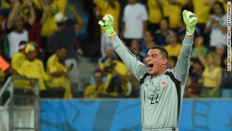 Colombia's goalkeeper Faryd Mondragon celebrates after Colombia scored their fourth goal during the Group C football match between Japan and Colombia at the Pantanal Arena in Cuiaba during the 2014 FIFA World Cup on June 24, 2014.  AFP PHOTO / LUIS ACOSTA        (Photo credit should read LUIS ACOSTA/AFP/Getty Images)