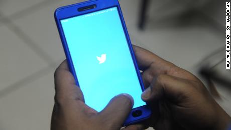 An Indian man poses for a photograph using Twitter on his cellpohne in Siliguri on March 27, 2018. 
India&#39;s ruling and main opposition parties on March 26 accused each other of using social media dirty tricks to mine and share followers&#39; personal data. Prime Minister Narendra Modi&#39;s Bharatiya Janata Party (BJP) and the Congress party of Rahul Gandhi have seized upon the data breach storm surrounding Facebook and other media to score political points against one another. / AFP PHOTO / DIPTENDU DUTTA        (Photo credit should read DIPTENDU DUTTA/AFP/Getty Images)