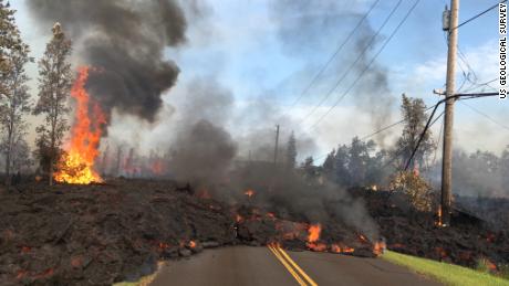 Lava slowly advances on Hookapu Street in Leilani Estates Saturday.