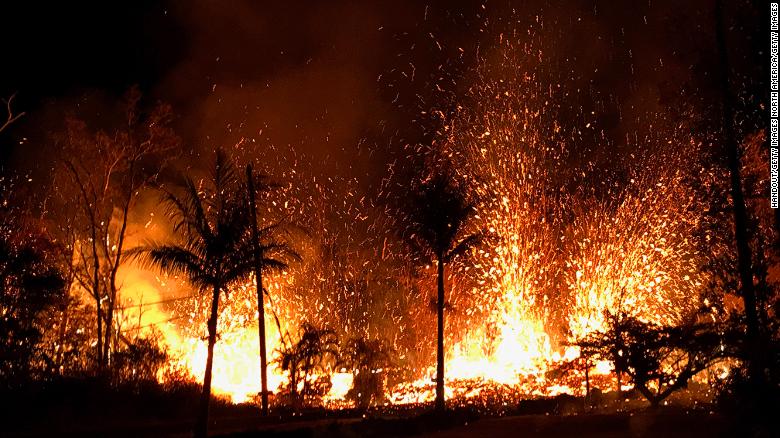 Lava spills through Hawaii neighborhood