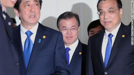 Japan&#39;s Shinzo Abe, from left, South Korea&#39;s Moon Jae-in and China&#39;s Li Keqiang meet in Tokyo.