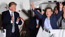 US President Donald Trump (L) applauds as US detainee Kim Dong-chul (2nd R) gestures upon his return with fellow detainees Kim Hak-song and Tony Kim (behind) after they were freed by North Korea, at Joint Base Andrews in Maryland on May 10, 2018. - US President Donald Trump greeted the three US citizens released by North Korea at the air base near Washington early on May 10, underscoring a much needed diplomatic win and a stepping stone to a historic summit with Kim Jong Un. (Photo by Nicholas Kamm / AFP)        (Photo credit should read NICHOLAS KAMM/AFP/Getty Images)