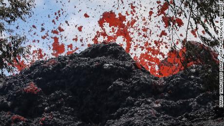 PAHOA, HI - MAY 12:  A lava fissure erupts in the aftermath of eruptions from the Kilauea volcano on Hawaii's Big Island, on May 12, 2018 in Pahoa, Hawaii. The U.S. Geological Survey said a recent lowering of the lava lake at the volcano's Halemaumau crater Òhas raised the potential for explosive eruptionsÓ at the volcano. Authorities have confirmed the fissure is the 16th to open.  (Photo by Mario Tama/Getty Images)